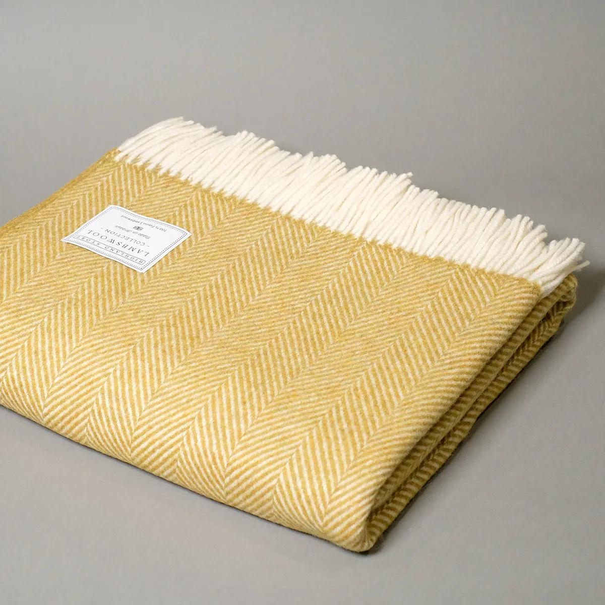 Fine Merino lambswool herringbone blanket in Mustard